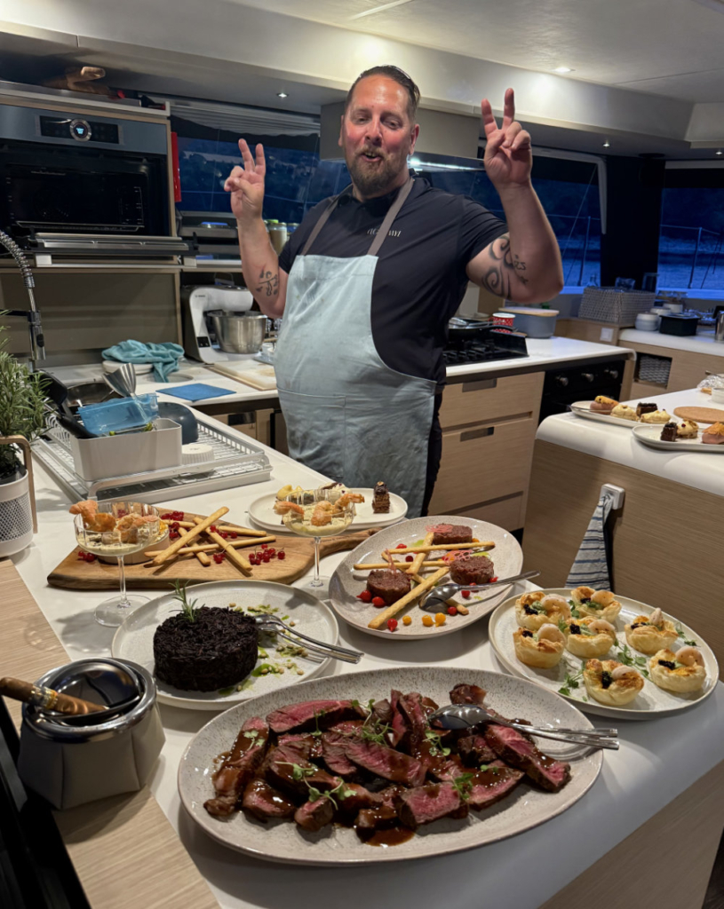 The cook in the kitchen on board our charter